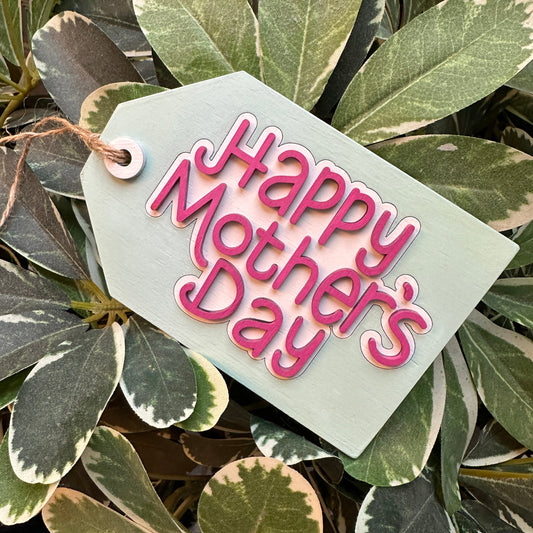 A laser-cut gift tag that says Happy MOther's Day