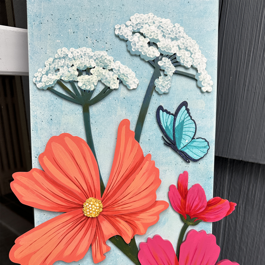 Decorative sign with flowers and butterflies on a textured surface