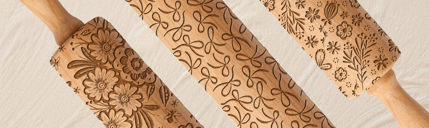 A laser engraved embossed rolling pin featuring garden bugs in a baking setting.