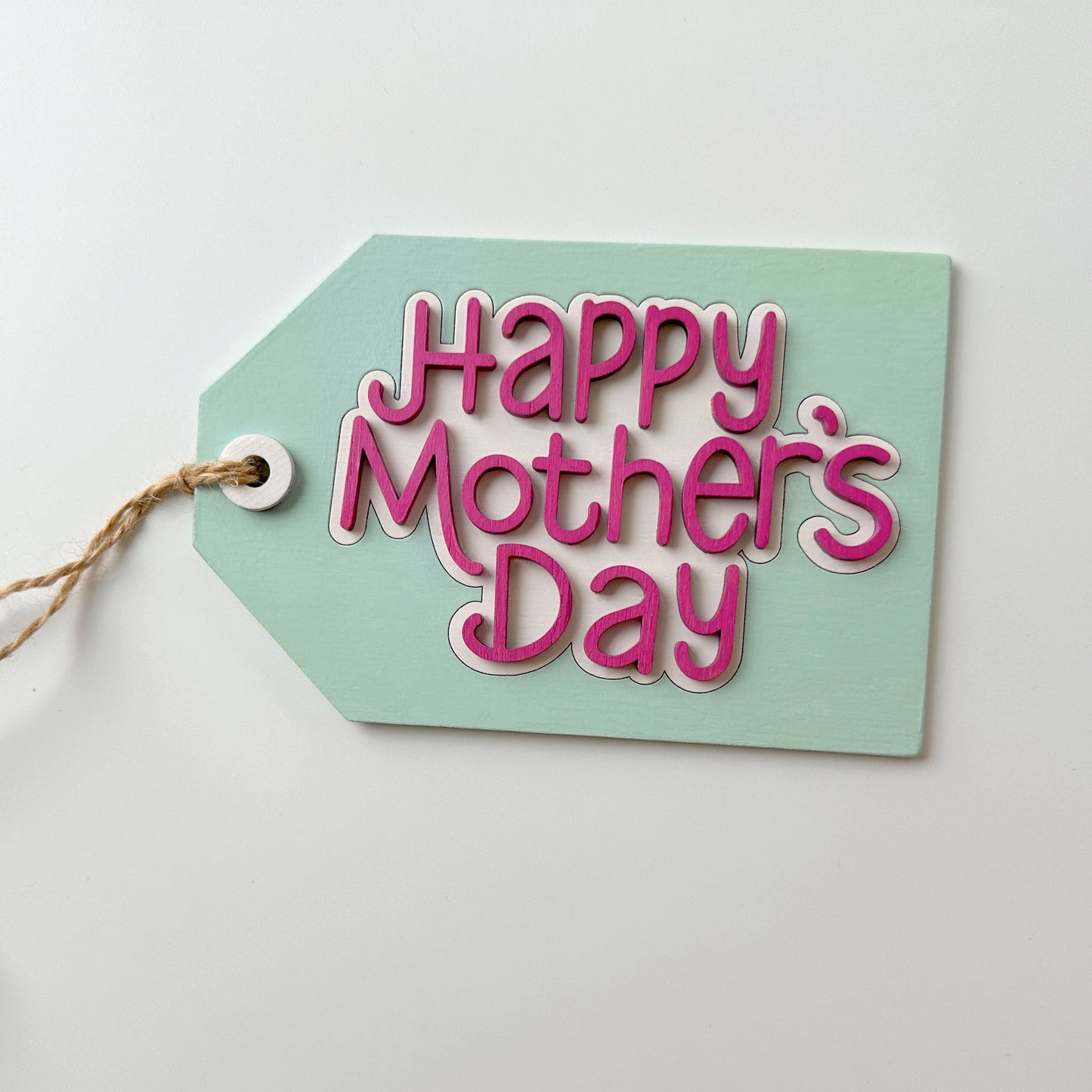 Mint green tag with 'Happy Mother's Day' text on a white background