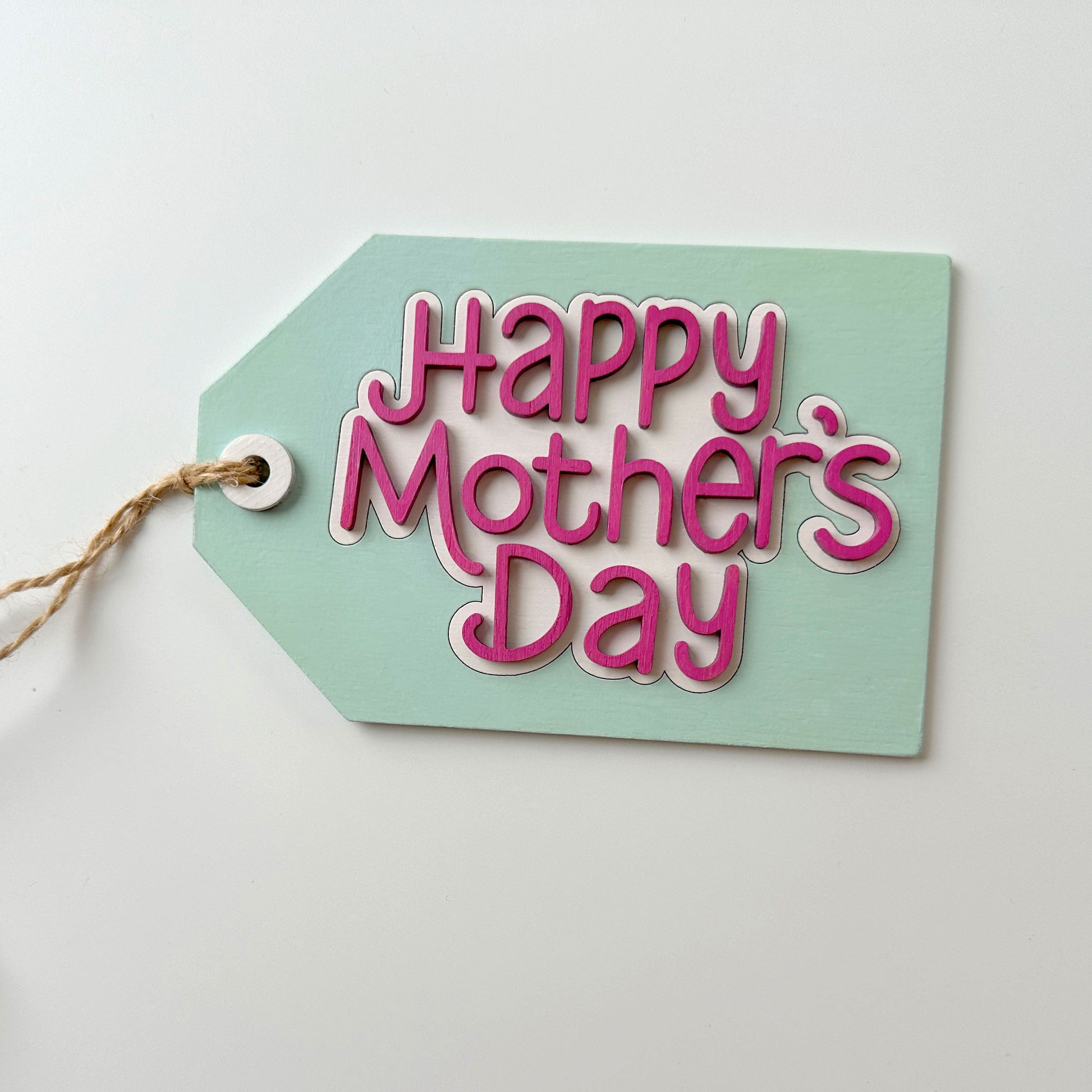 Mint green tag with 'Happy Mother's Day' text on a white background
