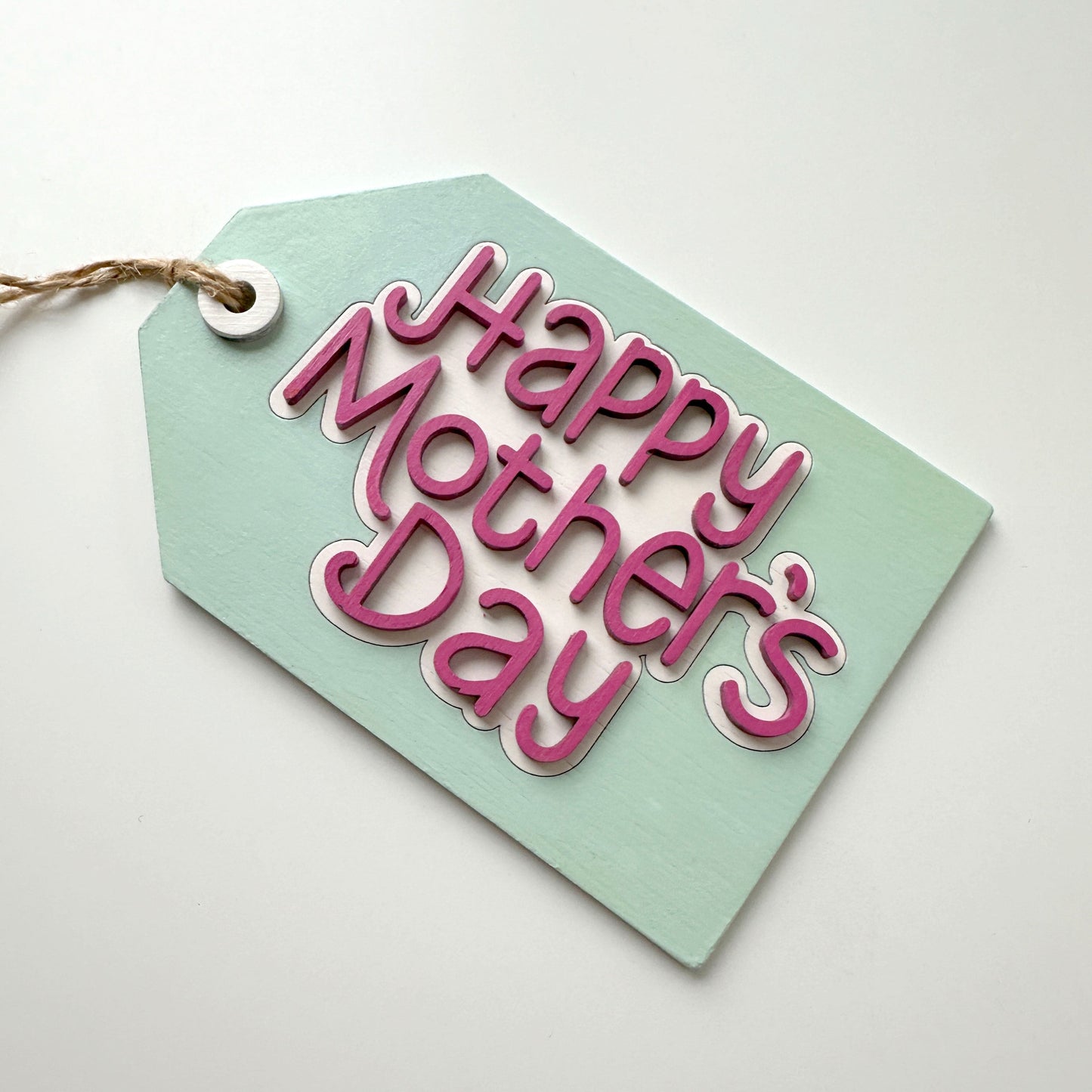 Green tag with 'Happy Mother's Day' text on a white background