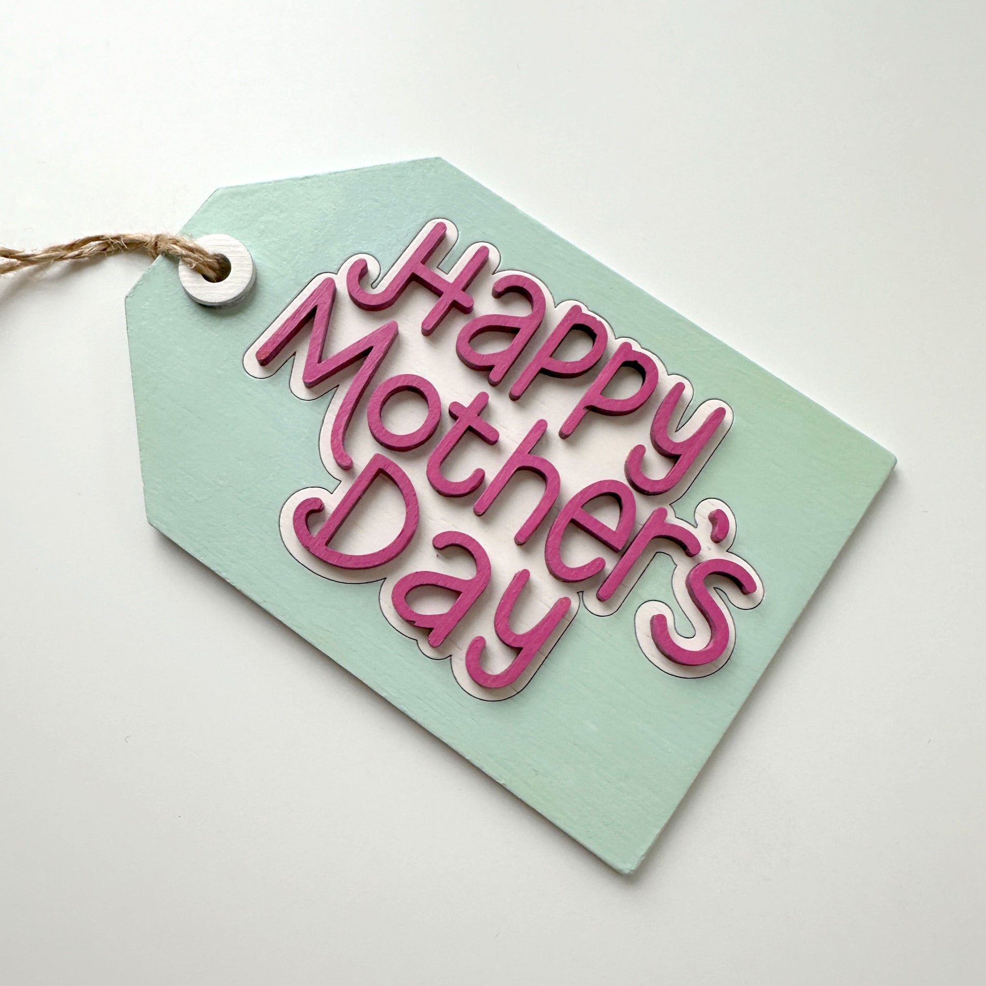 Green tag with 'Happy Mother's Day' text on a white background