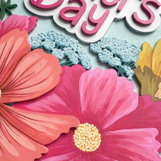 Card with pink flowers and 'Mother's Day' text on a light blue background