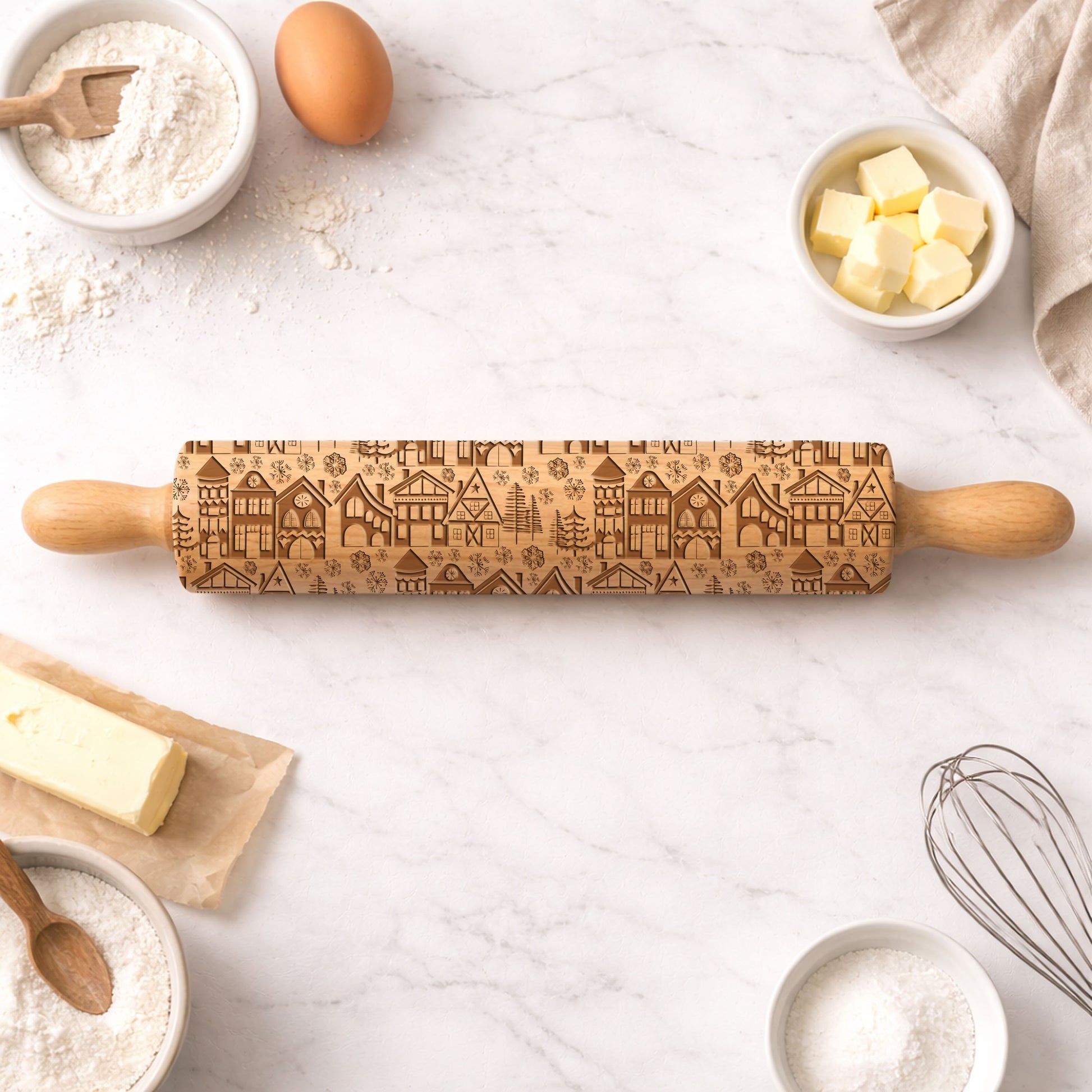 Wooden rolling pin with embossed pattern on a kitchen counter with baking ingredients.