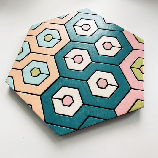 Hexagonal tile with geometric pattern on a white background