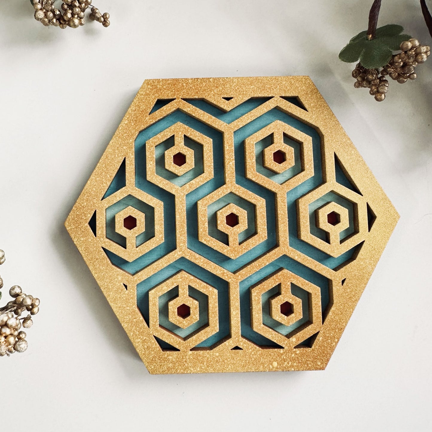 Decorative hexagonal wall art with geometric pattern on a light background