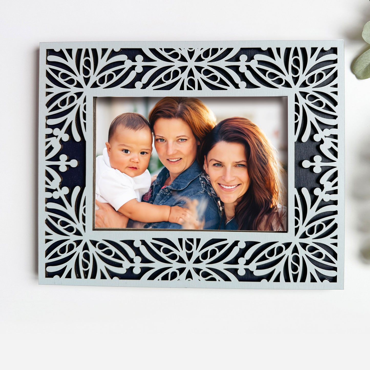 Decorative photo frame with a family portrait inside