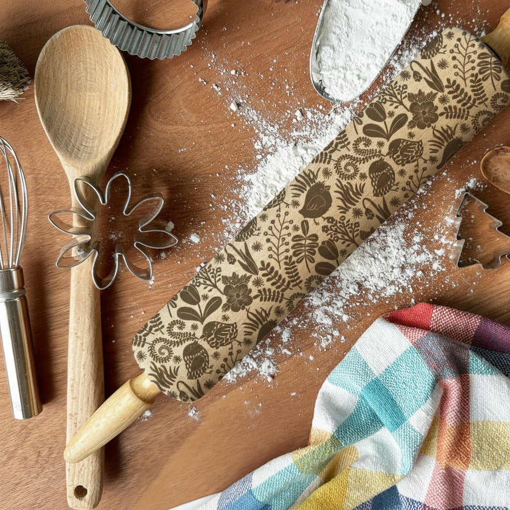 Baking tools and ingredients on a wooden surface with flour, a rolling pin, and cookie cutters.