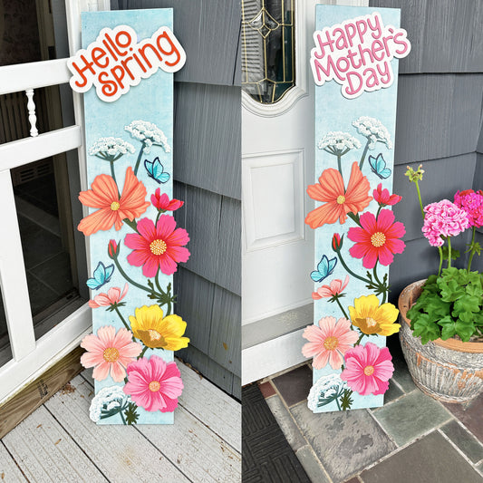 Decorative porch leaner signs with floral designs and text 'Hello Spring' and 'Happy Mother's Day' on a porch.