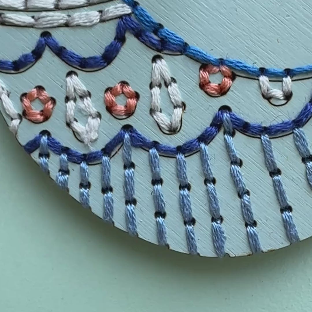 Whimsical songbird embroidery ornament video