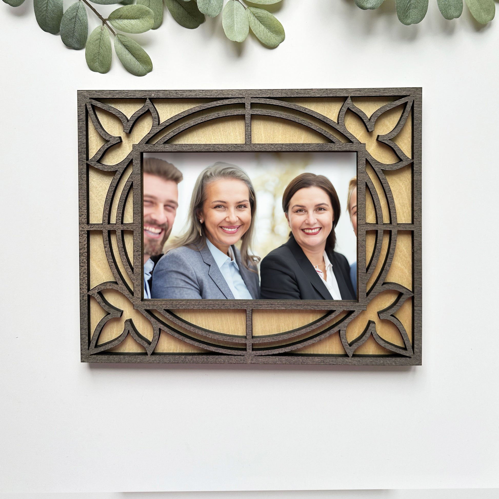 Decorative photo frame with a family portrait on a white background
