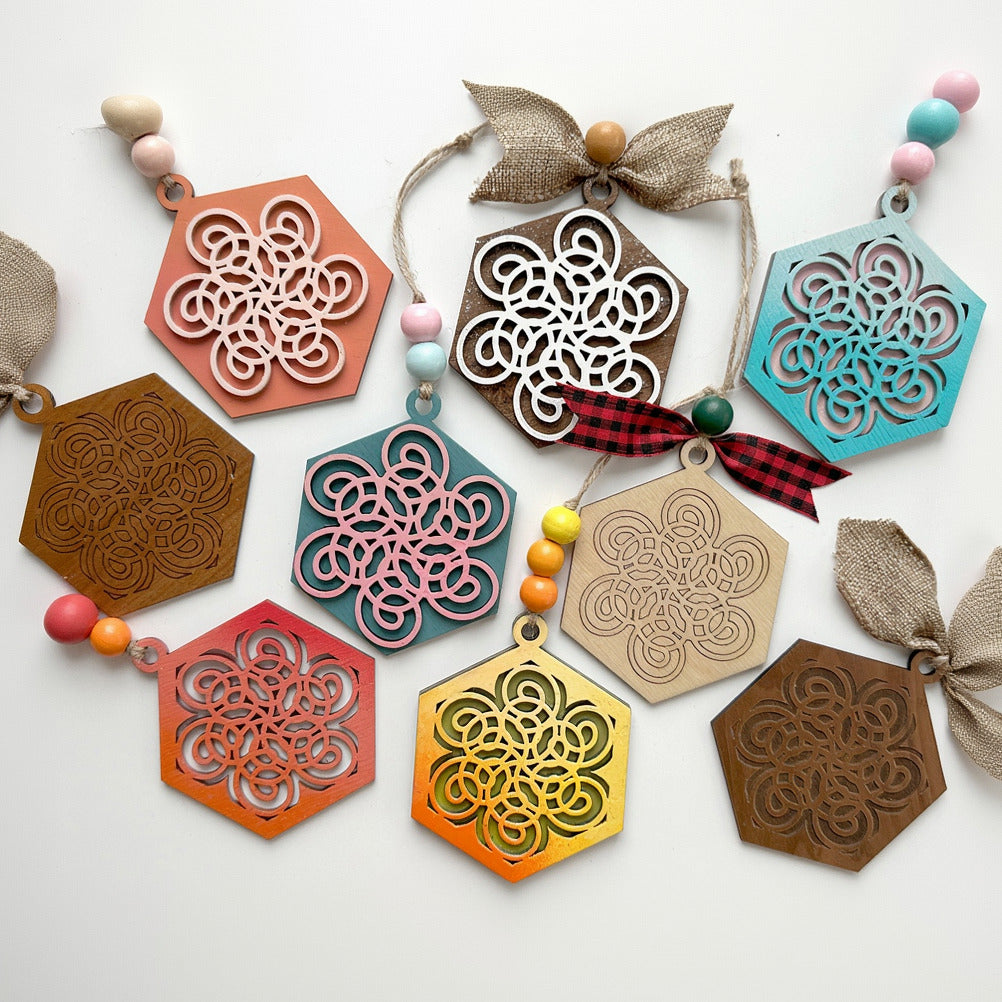 Colorful geometric wooden ornaments on a white background