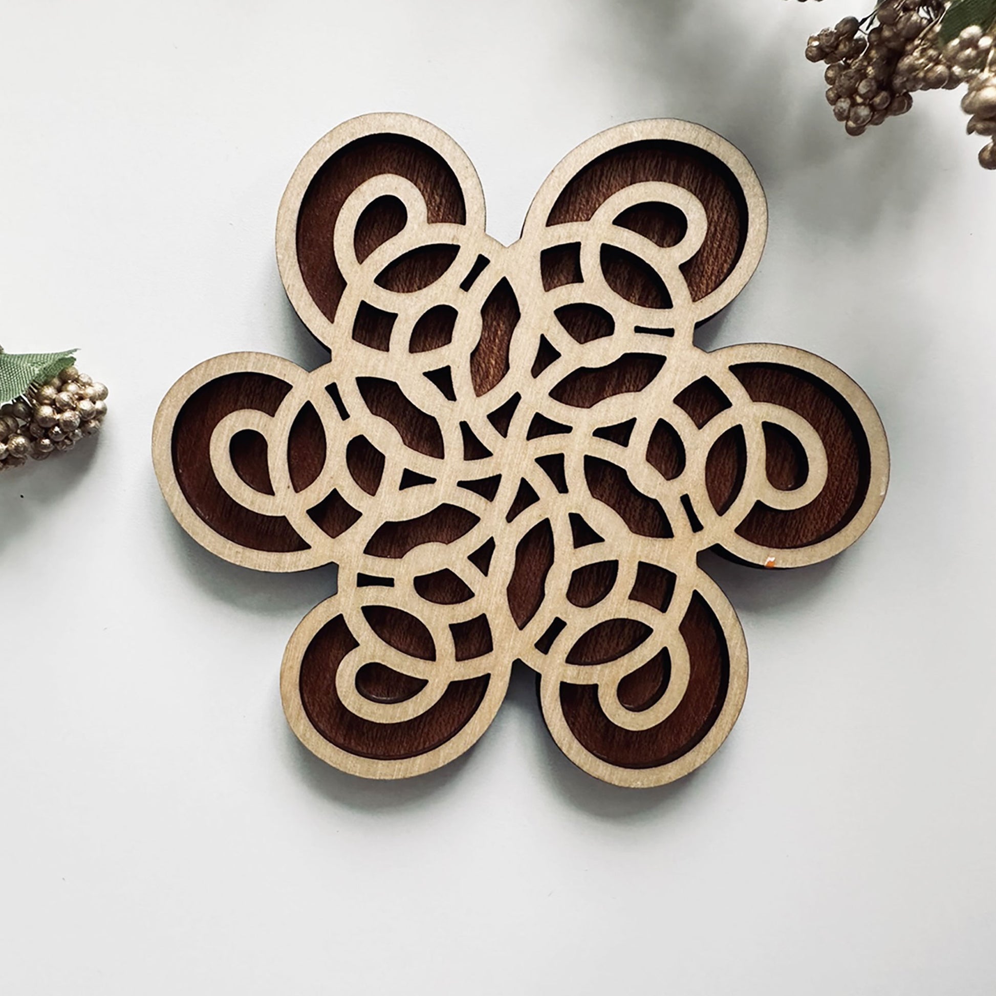Decorative wooden coaster on a light background
